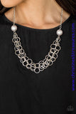 Two oversized silver pearls give way to dramatic silver chains, creating bold layers below the collar for a sassy look. Features an adjustable clasp closure. Sold as one individual necklace. Includes one pair of matching earrings.   P2IN-SVXX-183XX