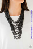 Brushed in an icy metallic shimmer, countless strands of gunmetal seed beads drape across the chest in a bold fashion. Featuring a collision of shapes and shimmer, the glittery strands connect to two large gunmetal accents for a flashy finish. Features an adjustable clasp closure. Sold as one individual necklace. Includes one pair of matching earrings.  P2SE-BKXX-219XX
