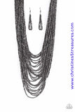 Brushed in an icy metallic shimmer, countless strands of gunmetal seed beads drape across the chest in a bold fashion. Featuring a collision of shapes and shimmer, the glittery strands connect to two large gunmetal accents for a flashy finish. Features an adjustable clasp closure. Sold as one individual necklace. Includes one pair of matching earrings.  P2SE-BKXX-219XX