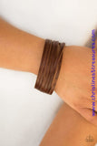 A brown leather band is spliced into various strands and wrapped around the wrist for a seasonal look. Features an adjustable snap closure. Sold as one individual bracelet.  P9UR-BNXX-312XX