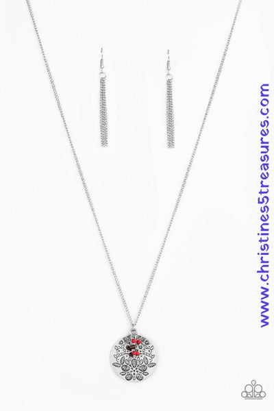 A floral embossed silver disc and dainty wooden and red stone beads swing from the bottom of a lengthened silver chain for a whimsical look. Features an adjustable clasp closure. Sold as one individual necklace. Includes one pair of matching earrings.  P2WH-RDXX-232XX
