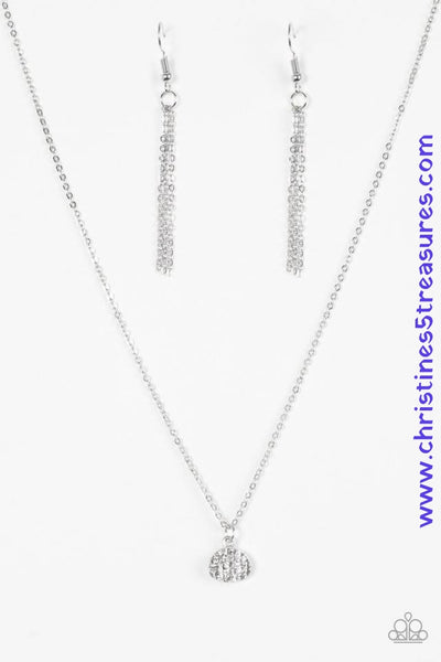 Encrusted in glassy white rhinestones, an asymmetrical silver frame swings from the bottom of a shimmery silver chain for a timeless look. Features an adjustable clasp closure. Sold as one individual necklace. Includes one pair of matching earrings. P2DA-WTXX-136XX