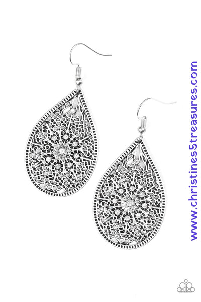 Featuring an elegant filigree filled backdrop, a shimmery silver teardrop swings from the ear. Dainty white rhinestones are sprinkled across the frame for a glamorous finish. Earring attaches to a standard fishhook fitting. Sold as one pair of earrings.  P5WH-WTXX-153XX