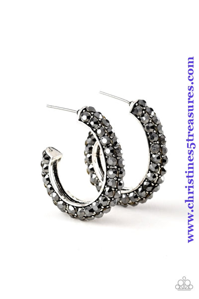 As if rolled in glitter, a shimmery gunmetal hoop is encrusted in row after row of sparkling white rhinestones for a show-stopping look. Earring attaches to a standard post fitting. Hoop measures 1" in diameter. Sold as one pair of hoop earrings.  P5HO-BKXX-115XX