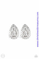 An oversized white rhinestone is nestled inside a hammered silver teardrop, creating a regal frame. Earring attaches to a standard clip-on fitting. Sold as one pair of clip-on earrings.  P5CO-WTXX-088XX