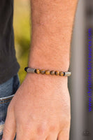 Infused with antiqued metallic accents, smooth black and energetic tiger's eye stone beads are threaded along a stretchy elastic band for a seasonal look. Sold as one individual bracelet.  P9SE-URBN-265XX