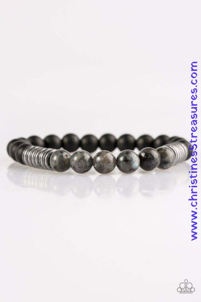Infused with antiqued metallic accents, smooth black and energetic natural stone beads are threaded along a stretchy elastic band for a seasonal look. Sold as one individual bracelet.  P9SE-URSV-127XX