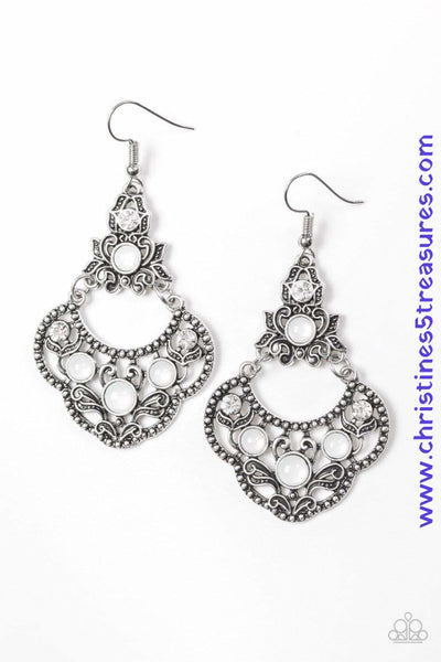 Glowing white beads and glittery white rhinestones are sprinkled along an ornate silver frame radiating with leafy filigree for a whimsical look. Earring attaches to a standard fishhook fitting. Sold as one pair of earrings.  P5WH-WTXX-147XX