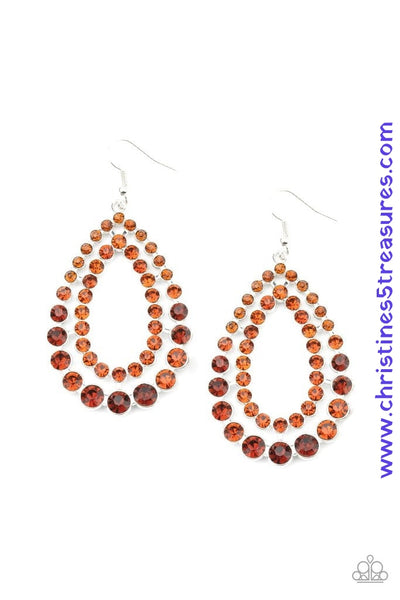Varying in size, rows of glittery topaz rhinestones coalesce into two blinding teardrops for a jaw-dropping dazzle. Earring attaches to a standard fishhook fitting. Sold as one pair of earrings.  P5RE-BNXX-097XX
