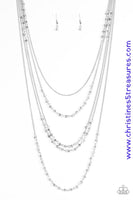 Brushed in a metallic shimmer, dainty beads trickle along silver chains, creating shimmery layers across the chest. Featuring faceted edges, the glittery beads cascade down the sides of the palette for an additional hint of sparkle. Features an adjustable clasp closure. Sold as one individual necklace. Includes one pair of matching earrings.  P2RE-SVXX-216XX