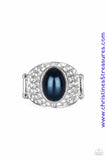 A pearly blue bead is pressed into the center of a bold silver band radiating with countless white rhinestones, creating a dramatic statement piece atop the finger. Features a stretchy band for a flexible fit. Sold as one individual ring.  P4RE-BLXX-160XX