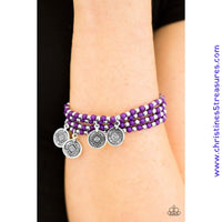 Dainty purple and silver beads are threaded along stretchy elastic bands, creating colorful layers across the wrist. Brushed in an antiqued shimmer, ornate silver charms swing from the wrist for a wanderlust finish. Sold as one set of four bracelets.   P9TR-PRXX-023XX