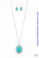 A dewy blue bead is pressed into the center of a stacked silver frame radiating with shimmery hammered textures. The oversized pendant swings from the bottom of a lengthened silver chain, adding a whimsical pop of color to any outfit. Features an adjustable clasp closure. Sold as one individual necklace. Includes one pair of matching earrings.  P2RE-BLXX-235XX