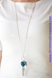 Infused with a lengthened silver chain, an array of glassy blue and shimmery silver accents swing from the bottom of a white rhinestone encrusted frame. A faceted blue heart frame swings from the bottom of the sparkling frame, adding a romantic finish to the whimsical tassel. Features an adjustable clasp closure. Sold as one individual necklace. Includes one pair of matching earrings. P2WH-BLXX-330XX