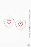 A dainty red rhinestone encrusted heart frame swings from the top of an oversized silver heart frame, creating a charming duo. Earring attaches to a standard fishhook fitting. Sold as one pair of earrings.  P5RE-RDXX-135XX
