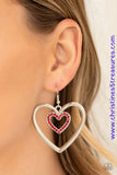 A dainty red rhinestone encrusted heart frame swings from the top of an oversized silver heart frame, creating a charming duo. Earring attaches to a standard fishhook fitting. Sold as one pair of earrings.  P5RE-RDXX-135XX