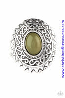 A glowing green stone is pressed in the center of a dramatic silver frame radiating with shimmery sunburst details for a seasonal look. Features a stretchy band for a flexible fit. Sold as one individual ring.   P4TR-GRXX-040XX