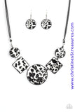 Featuring textured white and gray cheetah print, a wild collection of circle and square leather pieces are threaded along an invisible wire below the collar for a fierce look. Features an adjustable clasp closure. Sold as one individual necklace. Includes one pair of matching earrings. P2ST-WTXX-071XX