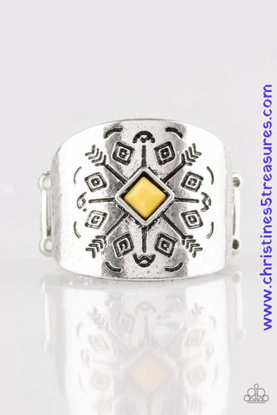 Stamped in arrow-like patterns, a thick silver band wraps across the finger. A faceted yellow bead adorns the center of the band, adding a colorful finish to the tribal inspired palette. Features a stretchy band for a flexible fit. Sold as one individual ring.  P4TR-YWXX-042XX