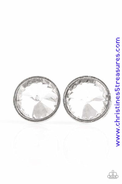 Featuring a regal prism style cut, a dramatic white gem is pressed into a sleek silver frame for a glamorous look. Earring attaches to a standard post fitting. Sold as one pair of post earrings.  P5PO-WTXX-116XX