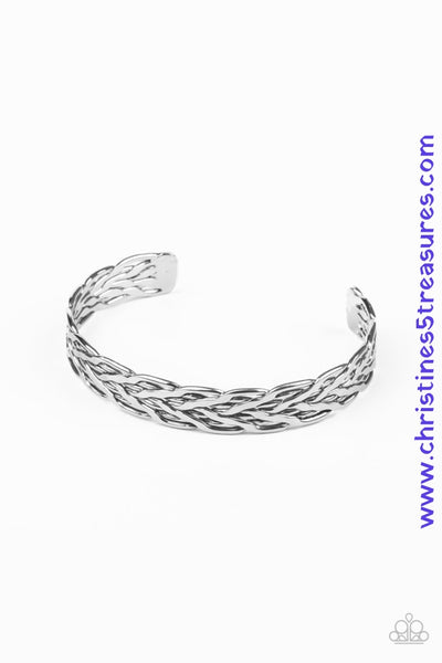 Delicately hammered in flattened texture, a series of flat silver bars weave and braid across the wrist, creating an edgy cuff. Sold as one individual bracelet. P9MN-URSV-034XX