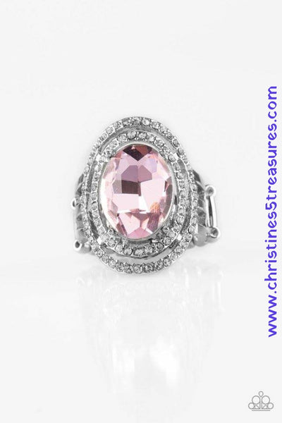 A glittery pink gem sits atop stacked silver frames radiating with glassy white rhinestones for a timeless look. Features a stretchy band for a flexible fit. Sold as one individual ring.  P4RE-PKXX-146XX