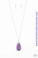 A dramatically oversized purple gem and edgy silver frame swing from a glassy white rhinestone fitting at the bottom of a lengthened silver chain for a glamorous look. Features an adjustable clasp closure. Sold as one individual necklace. Includes one pair of matching earrings.  P2RE-PRXX-181XX