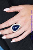 Chiseled into a tranquil teardrop, a depthless blue stone is pressed into a textured silver teardrop frame for a seasonal look. As the stone elements in this piece are natural, some color variation is normal. Features a stretchy band for a flexible fit. Sold as one individual ring.  P4SE-BLXX-179XX