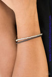 A strand of glistening silver beads and a strand of shiny brown leather cording wrap around the wrist, creating dainty layers. Features an adjustable sliding knot closure. Sold as one individual bracelet.  P9UR-BNXX-257XX