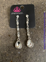 2020 April Life Of The Party Exclusive  Dainty white marquise rhinestone frames drip from a classic white rhinestone fitting. An oversized teardrop rhinestone swings from the bottom for a dramatic finish. Earring attaches to a standard post fitting. Sold as one pair of post earrings.  P5PO-WTXX-242XX