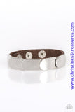 Overlapping silver frames are studded in place across a skinny brown leather band for a rugged look Features an adjustable snap closure. Sold as one individual bracelet.  P9UR-BNXX-395XX