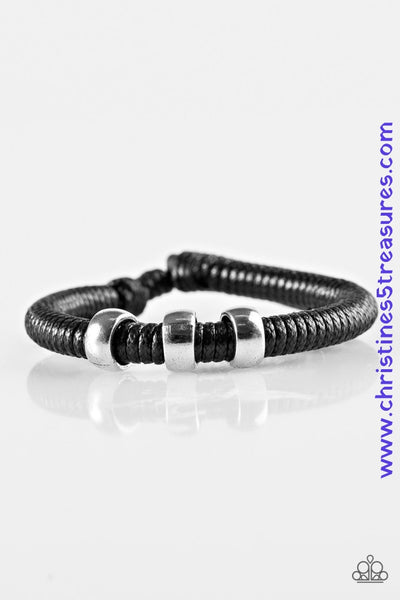 Shiny black twine wraps around a black cord, creating an urban look around the wrist. Shiny SILVER beads slide along the cording for a rugged finish. Features an adjustable sliding knot closure. Sold as one individual bracelet.  P9UR-BKXX-271QB