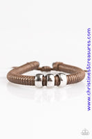 Shiny brown twine wraps around a black cord, creating an urban look around the wrist. Shiny silver beads slide along the cording for a rugged finish. Features an adjustable sliding knot closure. Sold as one individual bracelet.  Get The Complete Look! Necklace: “Trail Rules – Brown” (Sold Separately)  P9UR-BNXX-263PV