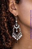 Glittery white rhinestones are sprinkled along stacked silver frames, creating an elegant lure. Matching white rhinestones swing from the bottom of the elaborate lure, adding a glamorous finish to the regal palette. Earring attaches to a standard fishhook fitting. Sold as one pair of earrings.  P5RE-WTXX-312XX