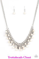 Earthy white stone beading cascades from the bottom of interlocking silver chains, creating an earthy fringe below the collar. Brushed in an antiqued shimmer, textured silver teardrops drip between the colorful beading for an artisan inspired finish. Features an adjustable clasp closure. Sold as one individual necklace. Includes one pair of matching earrings. P2SE-WTXX-147XX