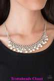 Earthy white stone beading cascades from the bottom of interlocking silver chains, creating an earthy fringe below the collar. Brushed in an antiqued shimmer, textured silver teardrops drip between the colorful beading for an artisan inspired finish. Features an adjustable clasp closure. Sold as one individual necklace. Includes one pair of matching earrings. P2SE-WTXX-147XX