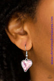 Cut into a whimsical heart shape, a glittery pink gem swings from the bottom of a glistening silver chain below the collar for a charming look. Features a toggle closure. Sold as one individual necklace. Includes one pair of matching earrings.  P2WH-PKXX-326XX
