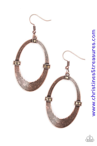 Etched in circular textures, a shimmery copper oval is encrusted in dainty topaz frames for an edgy look. Earring attaches to a standard fishhook fitting. Sold as one pair of earrings.  P5TR-CPXX-077XX