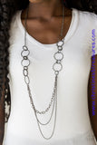 Smooth and shimmery textured hoops give way to layers of mismatched gunmetal chains for a classic look. Features an adjustable clasp closure. Sold as one individual necklace. Includes one pair of matching earrings.   P2IN-BKXX-138XX