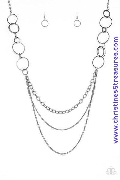 Smooth and shimmery textured hoops give way to layers of mismatched gunmetal chains for a classic look. Features an adjustable clasp closure. Sold as one individual necklace. Includes one pair of matching earrings.   P2IN-BKXX-138XX