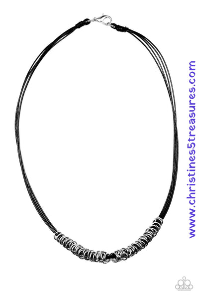 Timeless silver rings are threaded along a black cording, creating an urban look below the collar. Features a clasp closure. Sold as one individual necklace.  *** No earrings included ***  P2UR-BKXX-072XX
