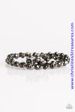 Brushed in a metallic sheen, glittery black crystal-like beads and faceted silver beads are threaded along stretchy elastic bands. Matching beads swing from the wrist, creating clustered centerpieces. Sold as one set of two bracelets.  P9RE-BKXX-185WK