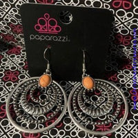 Textured silver hoops ripple from an energetic orange stone, creating a dizzying frame. Earring attaches to a standard fishhook fitting. Sold as one pair of earrings.  P5SE-OGXX-096XX