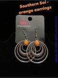 Textured silver hoops ripple from an energetic orange stone, creating a dizzying frame. Earring attaches to a standard fishhook fitting. Sold as one pair of earrings.  P5SE-OGXX-096XX