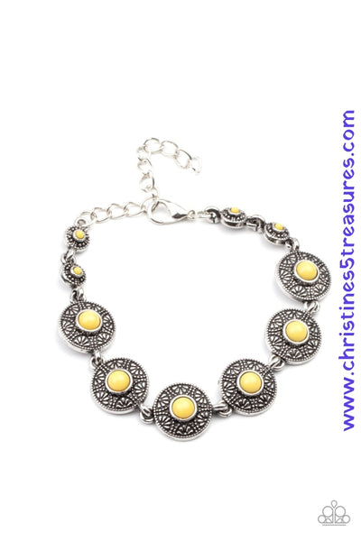 Dotted with sunny Illuminating beaded centers, dainty floral embossed silver frames delicately link around the wrist for a colorful springtime look. Features an adjustable clasp closure. Sold as one individual bracelet.  P9DA-YWXX-025XX