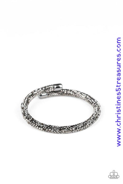 Bedazzled in glittery hematite rhinestones, a bendable cuff-like bracelet delicately curls around the wrist for a refined look. Sold as one individual bracelet.  P9RE-BKXX-273XX