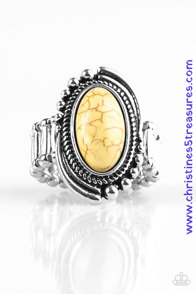 A sunny yellow stone is pressed into the center of an abstract silver frame featuring studded and serrated textures for a seasonal look. Features a stretchy band for a flexible fit. Sold as one individual ring.  P4SE-YWXX-046XX