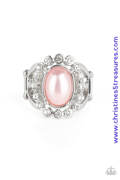 A ring of glassy white rhinestones spins around a pearly pink center, creating a refined statement piece atop the finger. Features a stretchy band for a flexible fit. Featured inside The Preview at ONE Life! Sold as one individual ring.  P4RE-PKXX-197XX