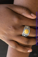 A sunny yellow stone is pressed into the center of an antiqued silver frame radiating with studded textures for an artisan inspired look. Features a stretchy band for a flexible fit. Sold as one individual ring.  P4SE-YWXX-050XX