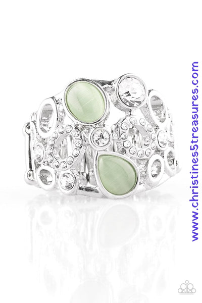 Shimmery silver frames, glassy white rhinestones, and glowing green moonstones coalesce across the finger, creating a bubbly frame. Features a stretchy band for a flexible fit. Sold as one individual ring.  P4RE-GRXX-095XX